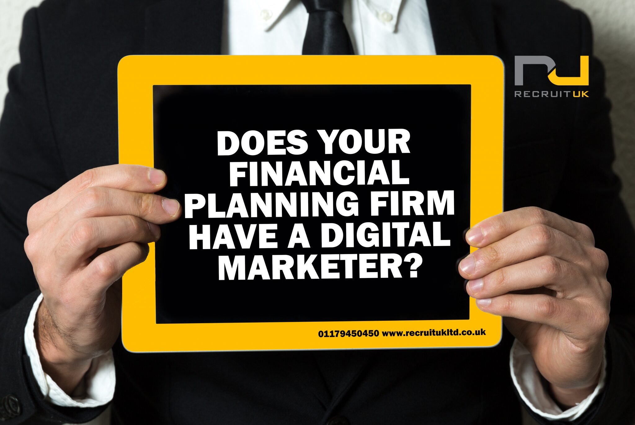 Man holding a sign saying 'Does your financial planning firm have a digital marketer?'