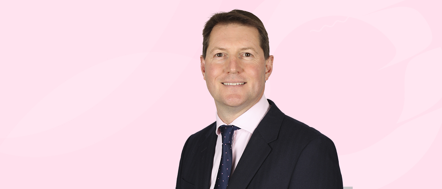 Portrait image James Roberts with a pink background