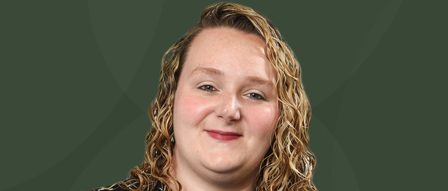 Portrait image of Jasmine Lambert with a green background